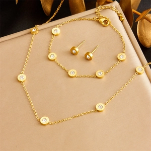 Gold stainless steel jewelry set with Roman numerals and crystals in three-piece luxury design