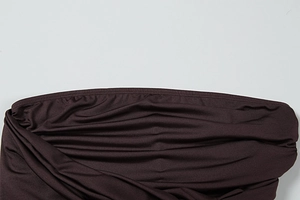 Detail of dark coffee ruched fabric with premium elastic texture and fine flat stitching