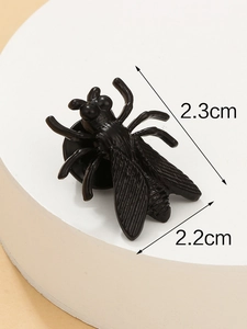 Detailed size view of black cicada bee insect brooch measuring 2.3cm x 2.2cm on display