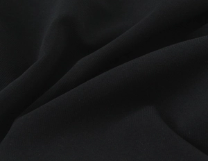 Close-up macro detail showing the soft texture of black knitted stretch fabric