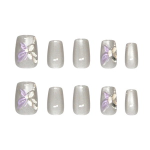 Sparkly purple butterfly cat eye press-on nails with 3D rhinestones and pearls