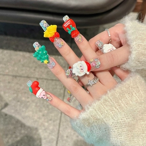 Luxurious 3D Christmas press-on nails featuring Santa, bells and trees on festive glitter base