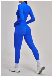 Detail view of the sleek blue high-waist fitness suit with premium stretch fabric