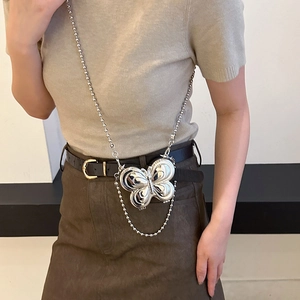 Chic silver butterfly-shaped mini crossbody bag with a beaded metallic chain strap