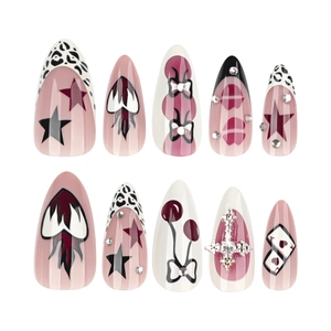 Y2K almond false nails with pink stars, leopard print, and gothic metal cross charms