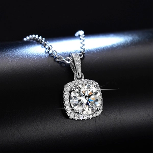 Macro shot of a brilliant moissanite halo pendant with refined metal craftsmanship