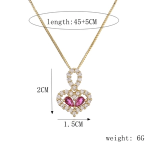 Detail view of pink heart pendant with dimensions 2cm by 1.5cm and chain length of 45+5cm