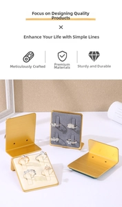 Detail of luxury gold metal ring display stand with premium velvet cushions for jewelry