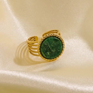 Minimalist 14K gold plated stainless steel ring featuring a green stone and wavy band