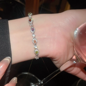 Detailed shot of multi-colored pear-cut gemstone bracelet with sparkling accents