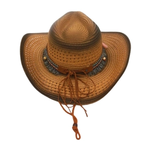 Detail of woven cowboy straw hat with colorful beads, ethnic bands and blue tassels