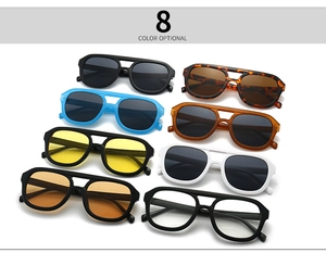 Flat lay showcasing eight color options of retro double-bridge flat top sunglasses