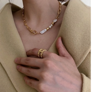 Golden baroque pearl necklace with OT toggle clasp and matching textured gold ring