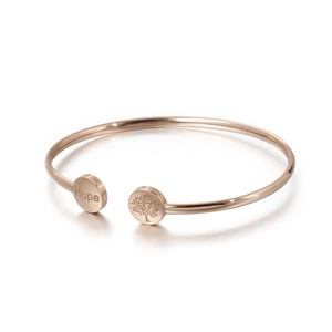 Rose gold stainless steel open bangle featuring Hope lettering and tree of life pattern