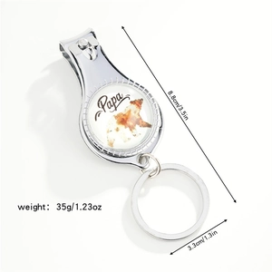 Macro shot of silver metal keychain nail clipper with Papa bear logo and size specs