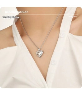 Wearing display of S925 sterling silver hollow heart pendant with white mother of pearl