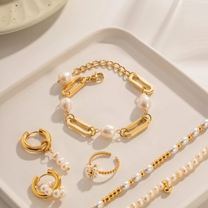 18K gold plated stainless steel jewelry set with Baroque pearls on a white tray
