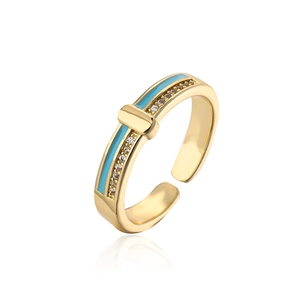 Detail of adjustable gold-plated ring with sky blue enamel and sparkling cubic zirconia