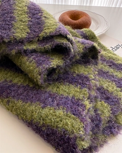 Macro detail of high-quality purple and green striped wool knit scarf texture