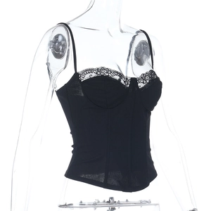 Detail of black lace trim and structured corset-style seams on slim-fit camisole top