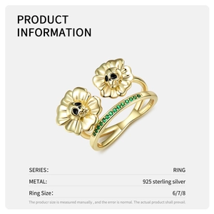 Vintage 925 sterling silver ring with golden sunflower skulls and green zircon stones