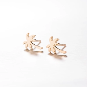 Golden palm tree stud earrings made of polished stainless steel for a summer beach look