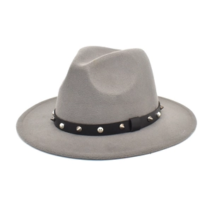 Detail of grey wool fedora hat featuring black leather belt with silver punk rivets
