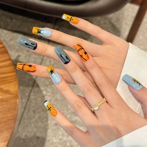 Halloween press-on nails set with hand-painted pumpkin and spider designs on long coffin nails