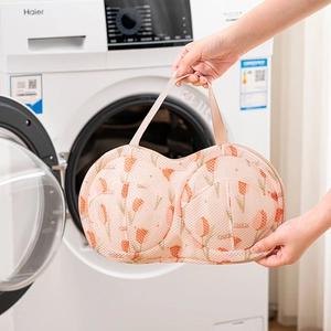 Tulip print laundry mesh bag for bras featuring a pink net design and a sturdy handle strap