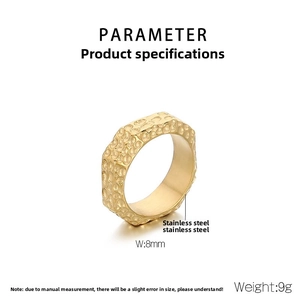 Detailed view of 8mm golden stainless steel ring with industrial hammered texture