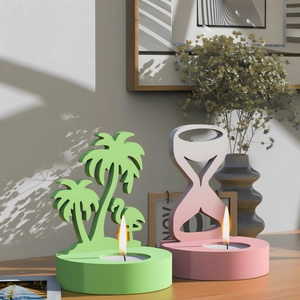 Silhouetted palm tree and flamingo candle holders in matte green and soft pink colors