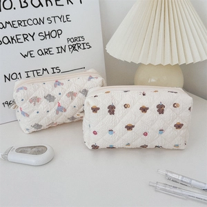 Close-up of quilted pencil case with cute cartoon prints and sturdy zipper detail
