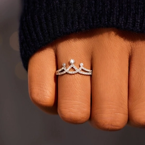 Elegant s925 crown ring for women with zircon inlay worn on finger in a close-up view