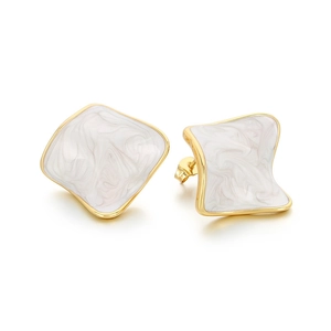 Elegant gold-plated stainless steel earrings with irregular black and white enamel cubes
