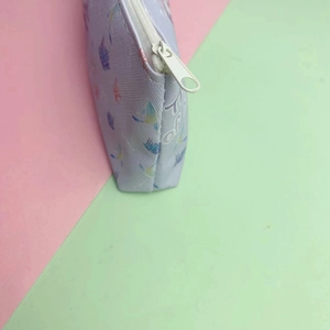 Cute astronaut stationery bag with large capacity featuring floral patterns and white zipper