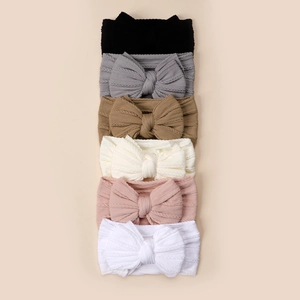 Lot de 6 bandeaux tricotés pour bébé avec nœuds papillon en diverses couleurs douces
