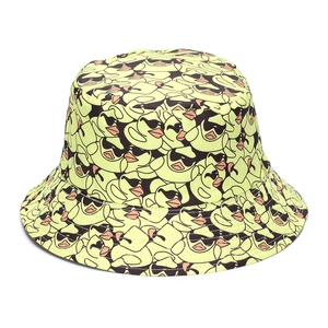 Detail shot of yellow bucket hat with cartoon duck print on high quality canvas fabric