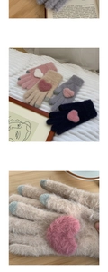 Detailed view of warm knit touchscreen gloves with heart decor in three colors