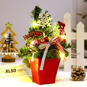 Mini lighted Christmas tree in red pot with LED lights and holiday ornaments