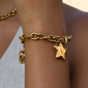 Chunky gold stainless steel link chain bracelet with a polished star pendant for women