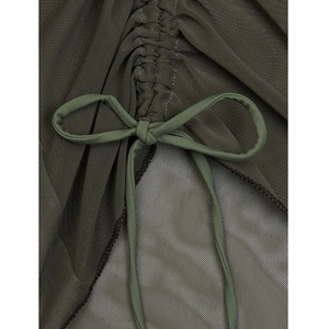 Detail of olive green mesh bikini with ruched texture and adjustable side drawstring bow