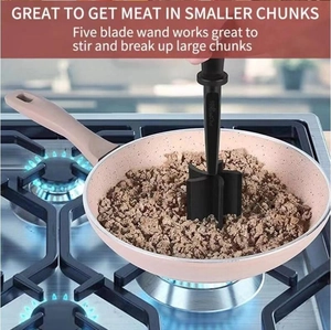 Detail view of five-blade meat chopper stirring ground meat in a skillet over a gas flame