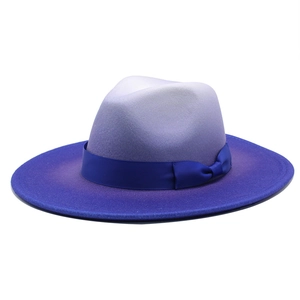 Detail of gradient felt fedora showing smooth purple wool texture and blue ribbon bow