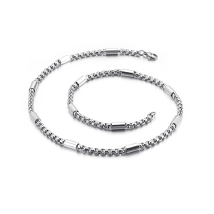 Detailed shot of stainless steel necklace with cylindrical beads and lobster clasp closure