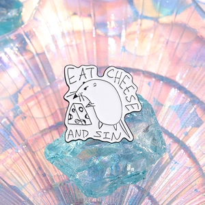 Cartoon opossum enamel pin holding cheese with Eat Cheese and Sin text in black and white