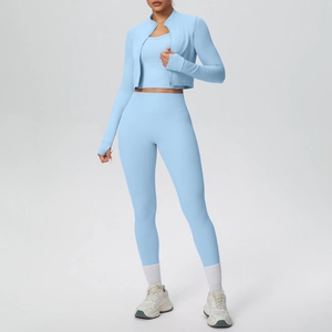 Detail of light blue 3-piece yoga set with zip-up jacket, sports bra, and high-waist leggings
