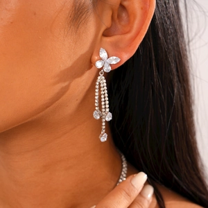 Detailed view of silver zircon butterfly earrings with long water-drop tassel pendants