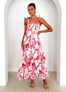Detail of tropical floral print dress with smocked bodice and bow shoulder straps