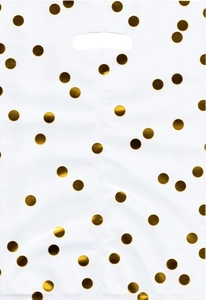 Detail of white plastic gift bag featuring metallic gold polka dots and oval handle