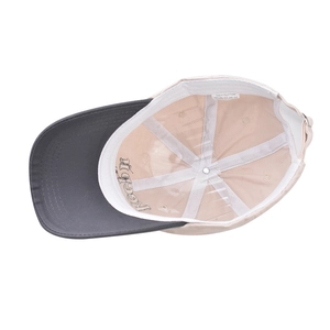 Detail showing the 100% cotton washed baseball cap interior with wash tag and adjustable buckle